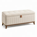 Banco de almacenamiento de tela beige con patas de madera