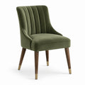 Silla de terciopelo verde con patas de madera de nogal